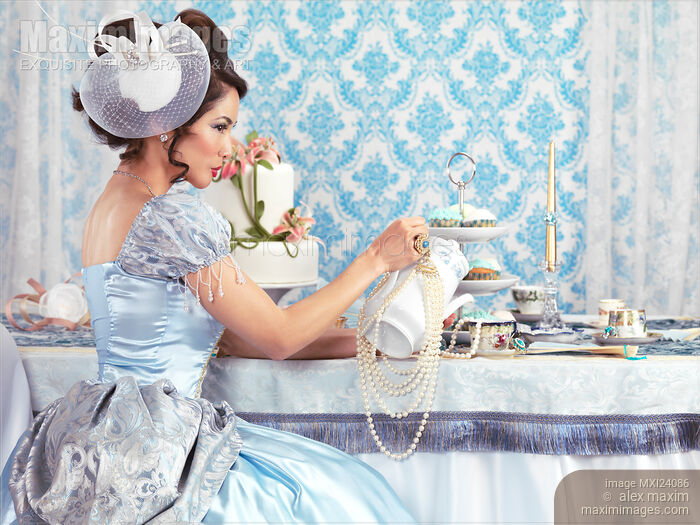 Lady at a tea party Stock Image MXI24086 © Alex Maxim / MaximImages